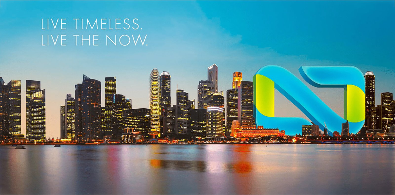 its skyline at dusk with glowing skyscrapers and the NOW Realty logo placed over the waterfront.