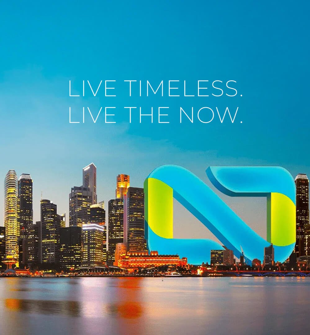 its skyline at dusk with a glowing skyscraper and the NOW Realty logo placed over the waterfront.