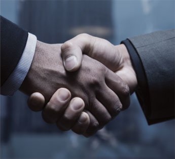 Woman sitting peacefully by the lakeside, soaking in the calm evening air.