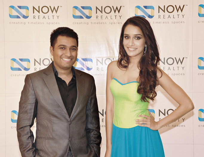 NOW Realty event photo featuring a company representative posing with actress Shraddha Kapoor